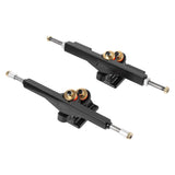 Angled view of Tynee electric skateboard DKP trucks for 165mm Hobbywing hub motors, showing black hangers, exposed axle ends and double kingpin assemblies.